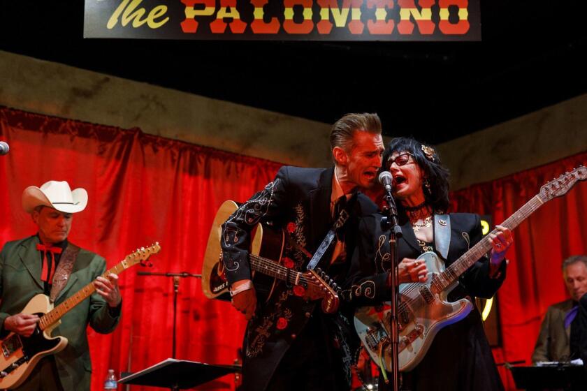 James Intveld and Rosie Flores perform together at the recreated Palomino Club on Monday, October 8, 2018 in North Hollywood, Calif. Closed in 1995, the Palomino Club was an L.A. country music haven - recreated for one night in the original location as a benefit concert aiding the Valley Relics Museum in Chatsworth. (Patrick T. Fallon/ For The Los Angeles Times)