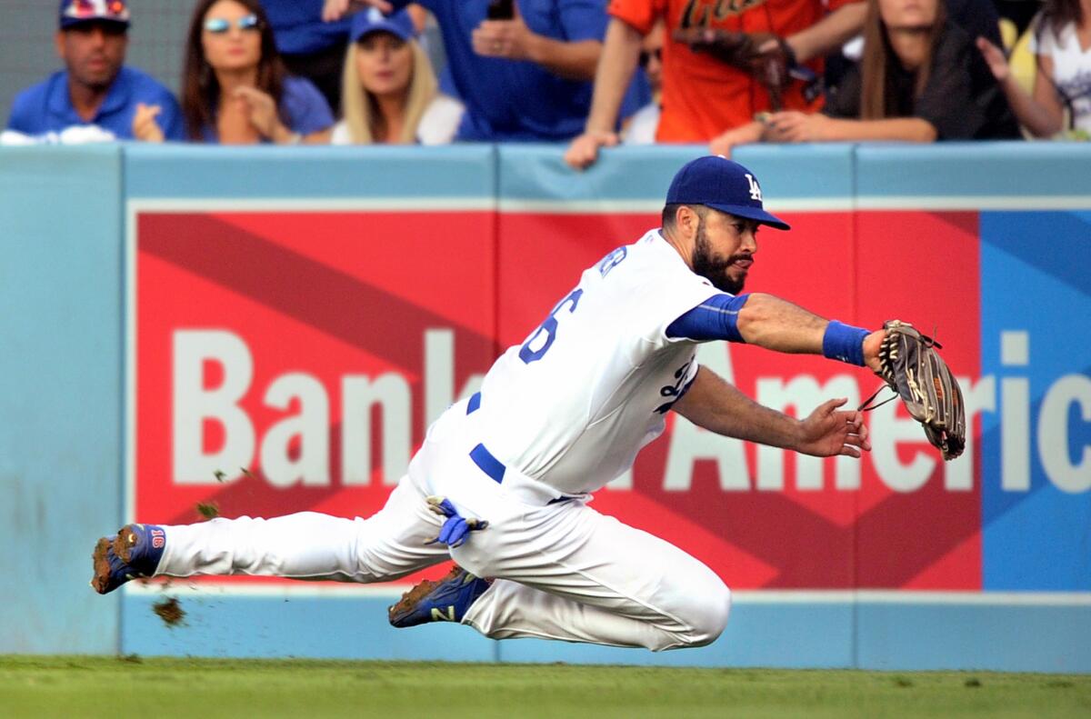 Dodgers right fielder Andre Ethier meets a deep drive by Mets left fielder Michael Conforto in the second inning of Game 5.