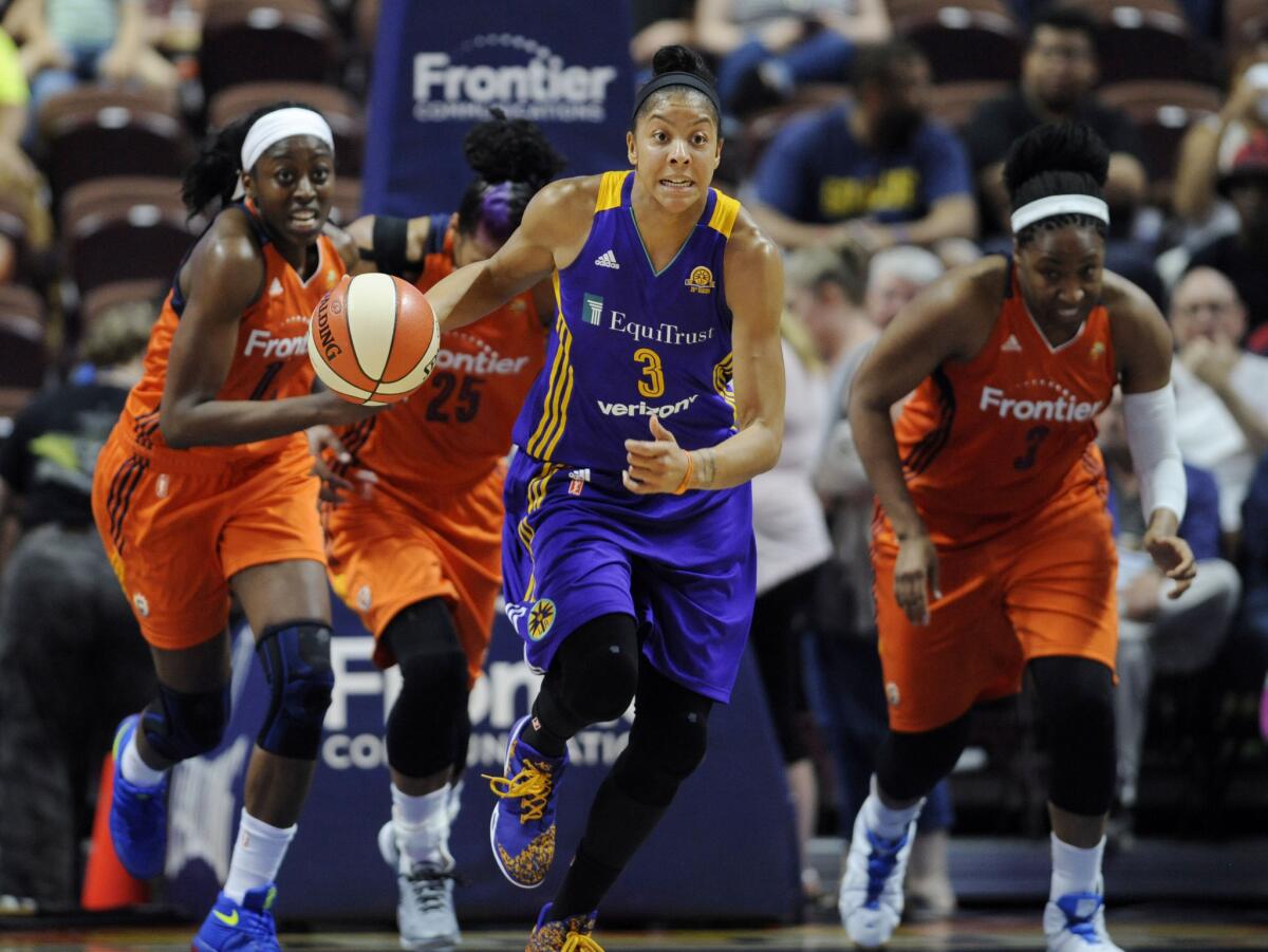 Sparks forward Candace Parker breaks away from the Connecticut Sun defense during the first half of a game on May 26.