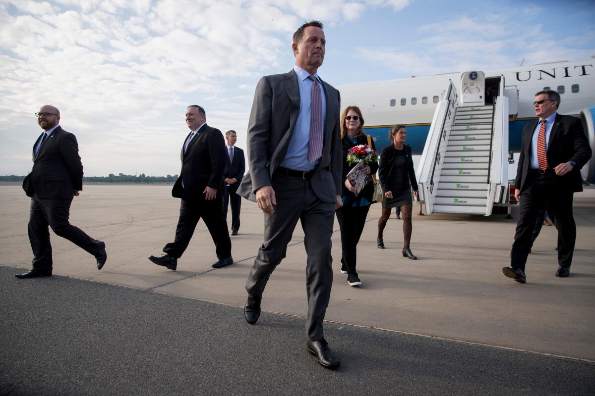 Richard Grenell, U.S. ambassador to Germany, walks to his vehicle after greeting Secretary of State Michael R. Pompeo at a Berlin airport last May.
