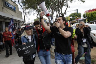 Brandon Straka, the founder and president of #WalkAway movemet, marches.