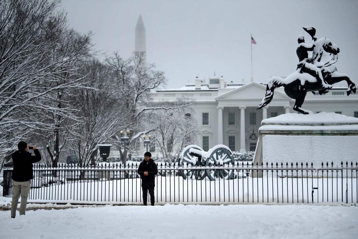 The White House, shown in this week's snow, was the intended target of a man arrested Wednesday in a sting, according to authorities.
