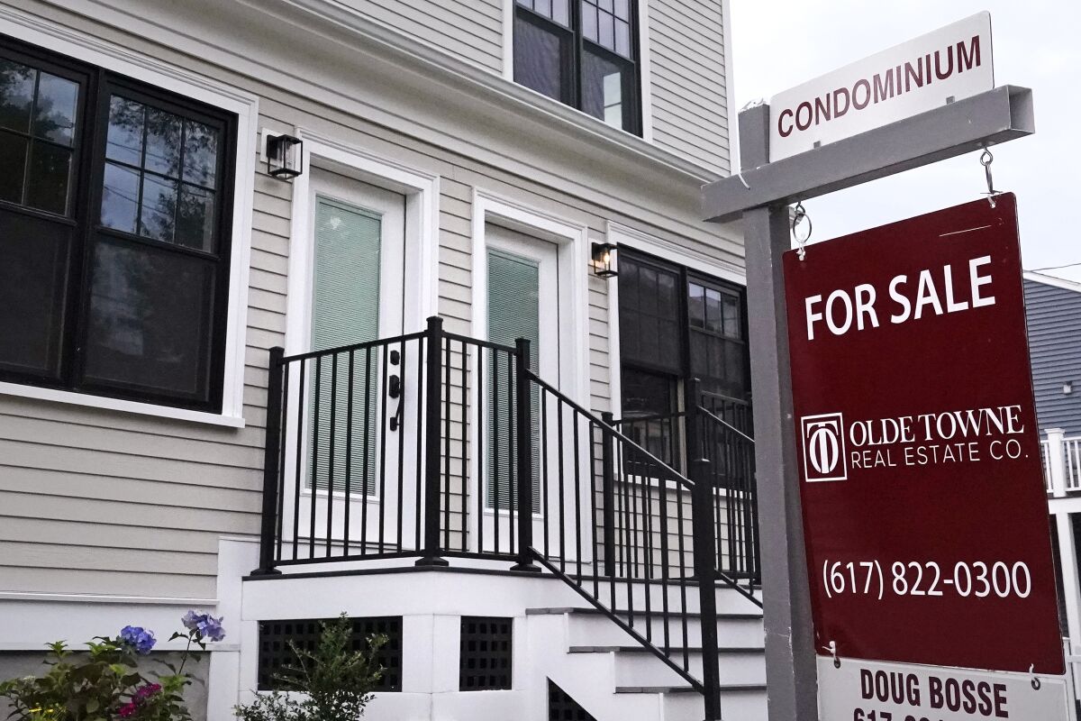 Condominium units are offered for sale in the Dorchester neighborhood, Wednesday, Aug. 18, 2021, in Boston. Average long-term U.S. mortgage rates rose in the past week to start 2022. (AP Photo/Charles Krupa)