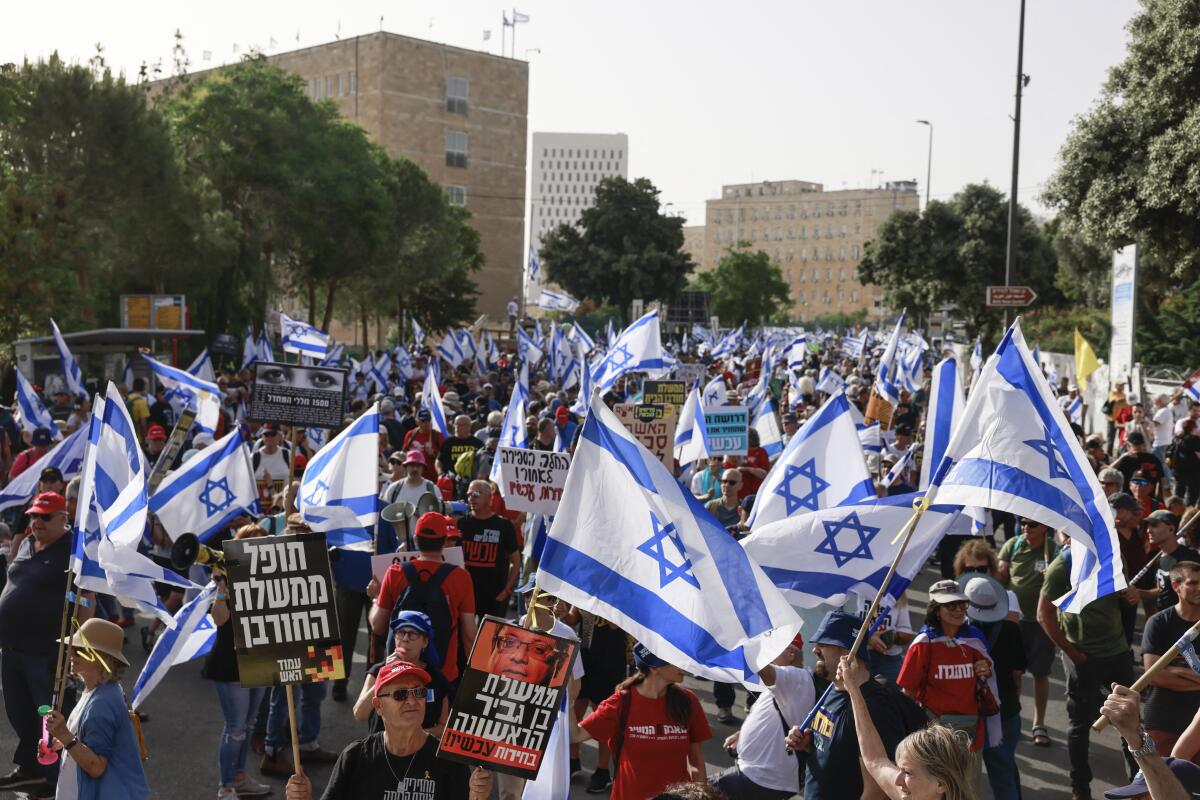 Israelis protest against Prime Minister Benjamin Netanyahu's government in front of the Israeli parliament in Jerusalem.