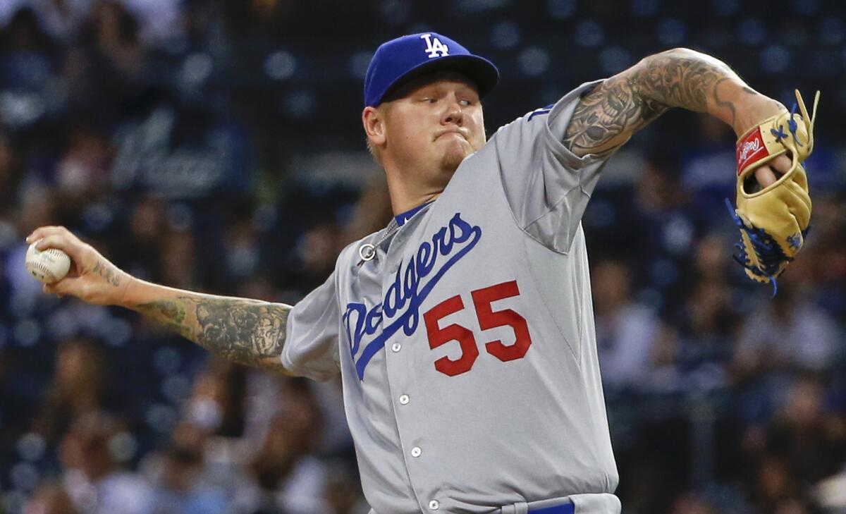 Former Dodgers starting pitcher Mat Latos works against the San Diego Padres during a game on Sept. 3. Latos was signed Monday by the Angels.