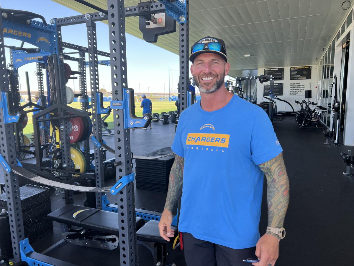 Former Chargers All-Pro center Nick Hardwick takes a break in the weight room.