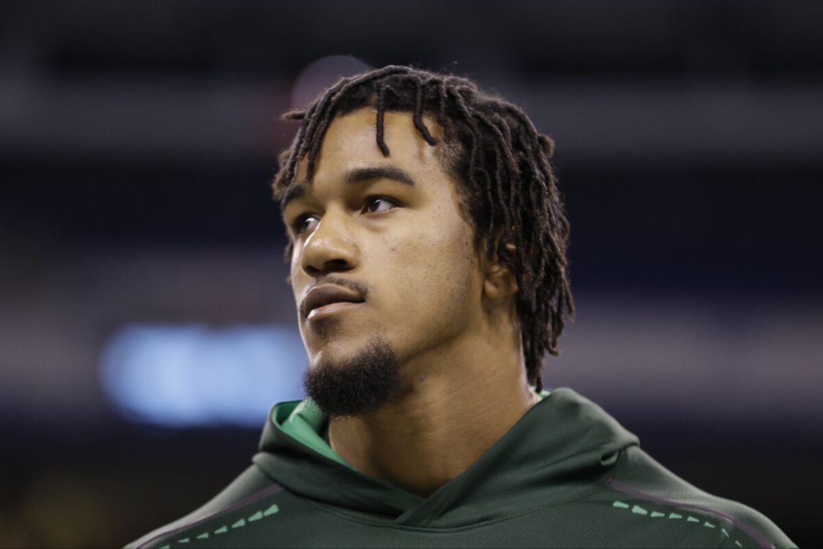 Clemson defensive end Vic Beasley stretches before drills at the NFL scouting combine in Indianapolis on Feb. 22.