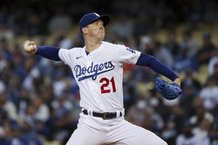 Los Angeles, CA - October 12: Los Angeles Dodgers starting pitcher Walker Buehler delivers a pitch.