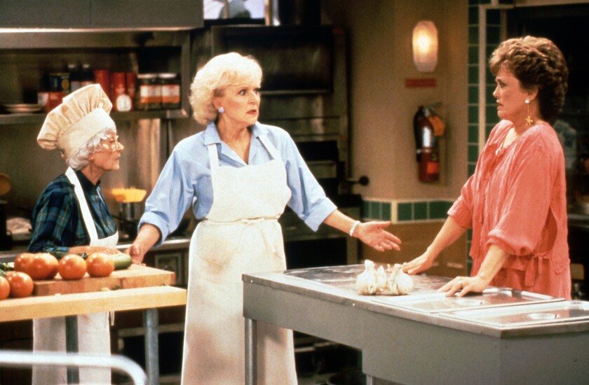 Three women in a hotel kitchen