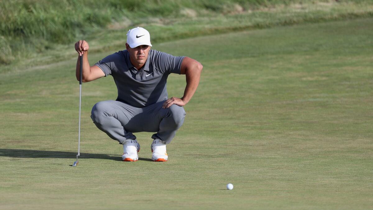 Brooks Koepka putts on the 18th green during the final round of the U.S. Open.