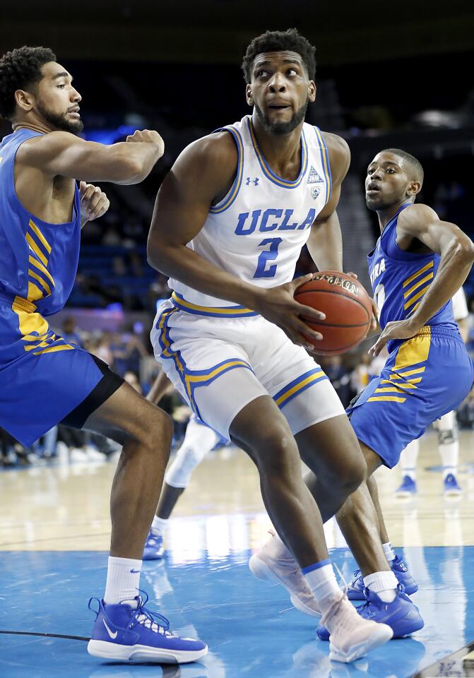 Bruins forward Cody Riley pivots to the basket.