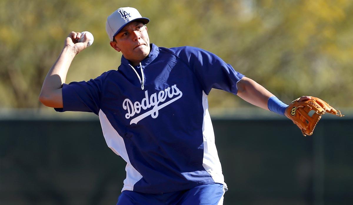 Dodgers infielder Miguel Rojas takes part in a workout during spring training in February.