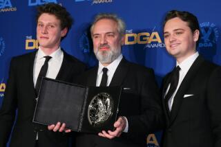 "1917" director Sam Mendes with actors George MacKay and Dean-Charles Chapman at the DGA Awards.