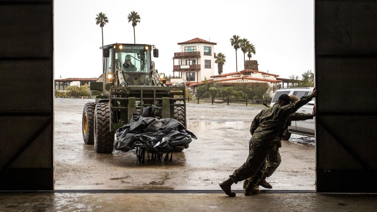 U.S. Marines move supplies into an airport hangar to begin work on the aging airport runway on Santa Catalina Island.