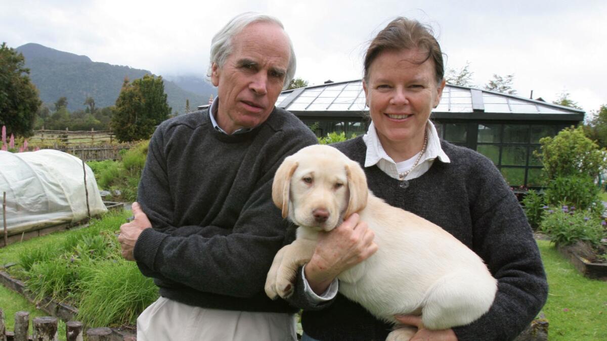 Douglas Tompkins and his second wife, Kris, shown with their puppy, Huacho, at their Chilean homestead in 2006.
