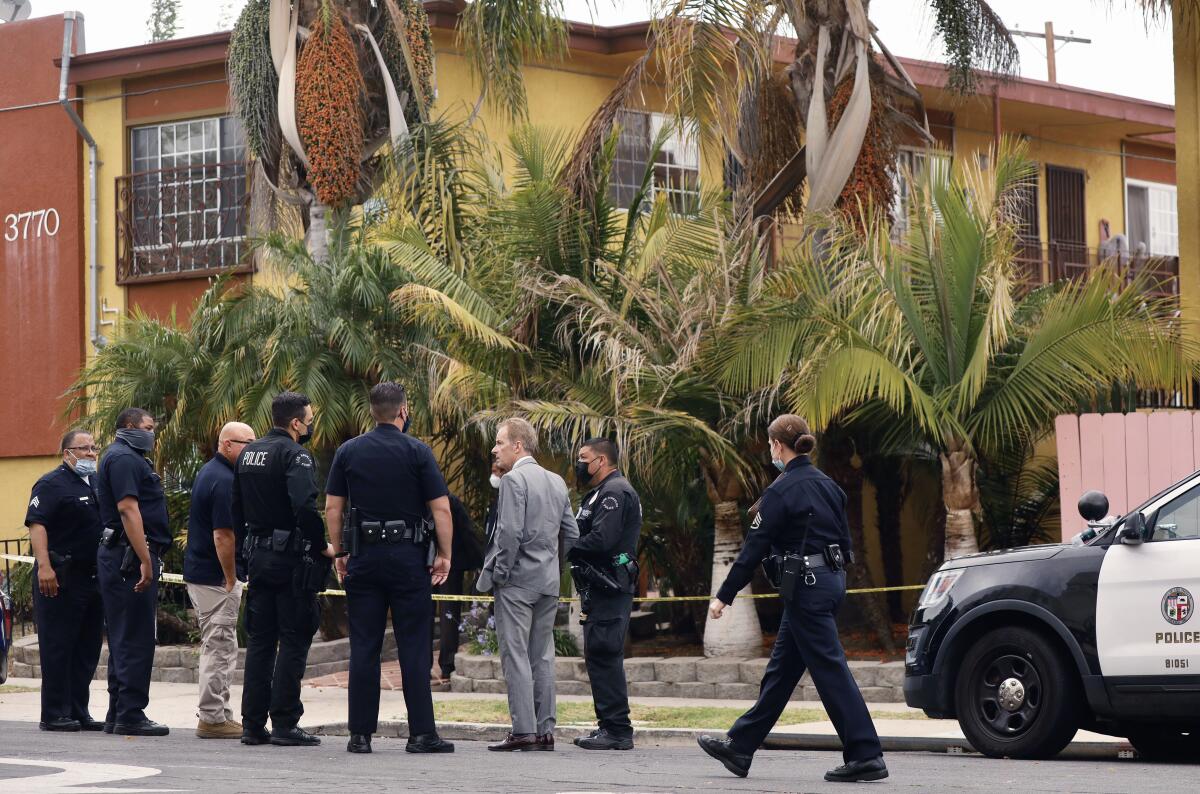 Los Angeles police gather at the scene of a fatal shooting.