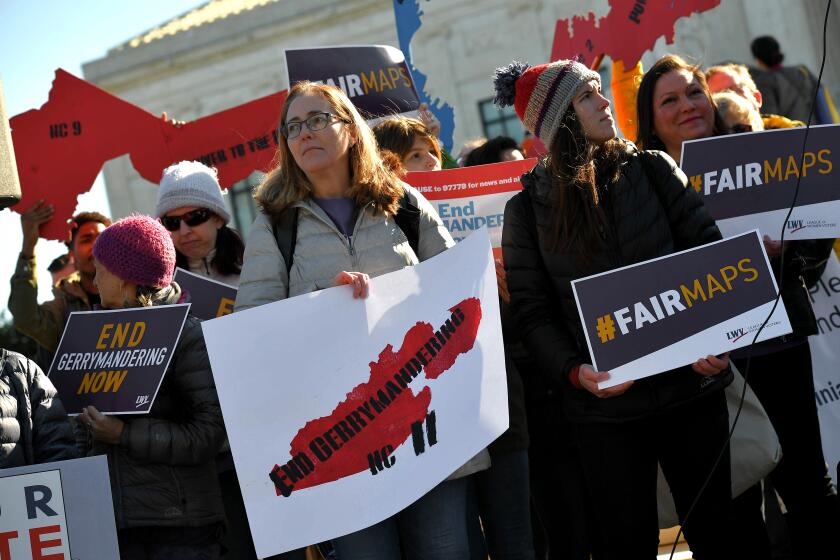 People gather during a rally to coincide with the Supreme Court hearings on the redistricting cases in Maryland and North Carolina, in front of the US Supreme Court in Washington, DC on March 26, 2019. - The US Supreme Court is set Tuesday to once more hear arguments on gerrymandering, the dark art of redrawing political boundaries to extract partisan advantage: a practice that is almost as old as the country itself. The latest cases to come before the highest bench are from North Carolina, where Republican lawmakers are accused of devising electoral maps to favor themselves; and Maryland, where Democrats are accused of the same. (Photo by MANDEL NGAN / AFP)MANDEL NGAN/AFP/Getty Images ** OUTS - ELSENT, FPG, CM - OUTS * NM, PH, VA if sourced by CT, LA or MoD **