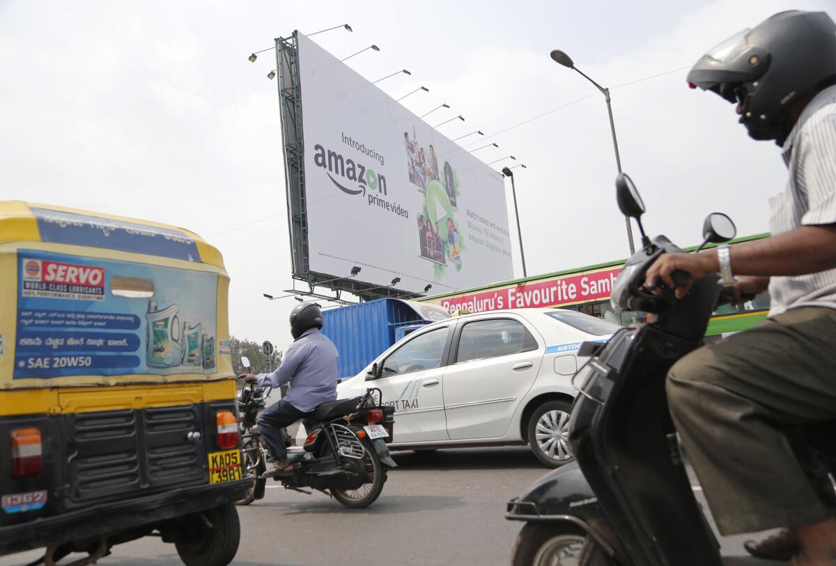 An Amazon billboard overlooks a roadway in Bangalore, India. After India's foreign minister complained, the online retailer stopped selling doormats depicting the Indian flag through its Canadian website.