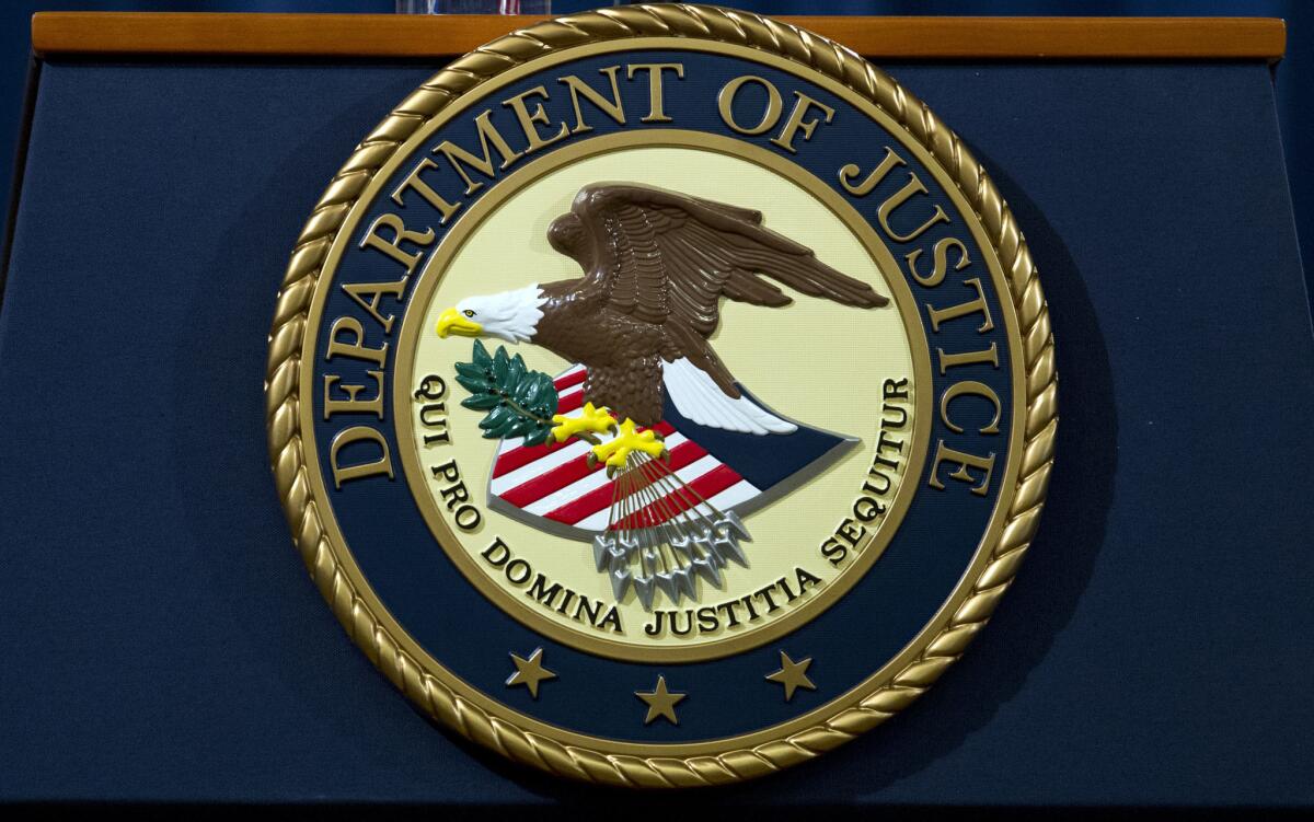 The Department of Justice seal.