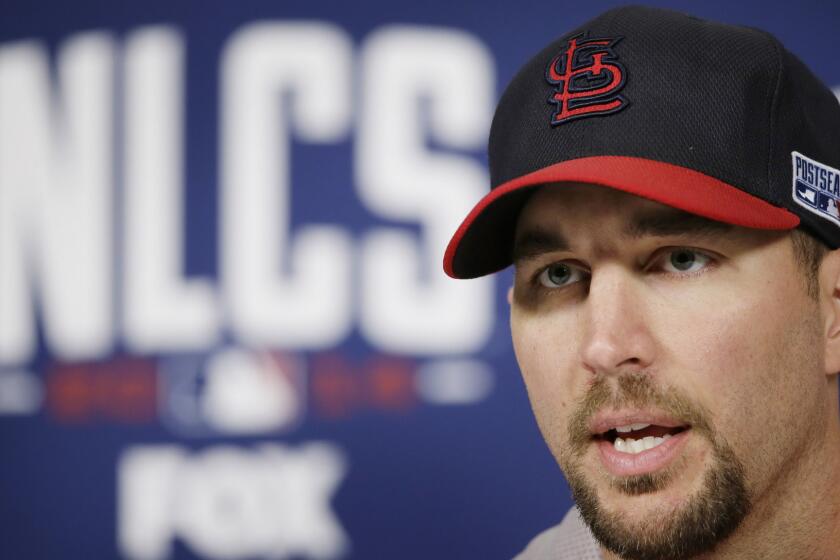 St. Louis Cardinals starting pitcher Adam Wainwright speaks during a news conference Friday.