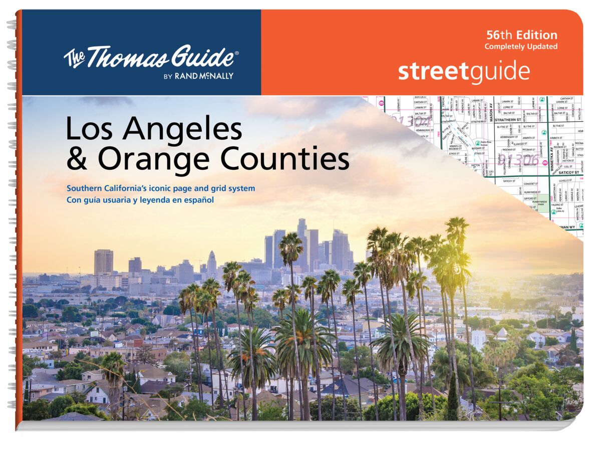 The cover of the new Thomas Guide for Los Angeles and Orange counties shows sunlit palm trees with downtown L.A. beyond.