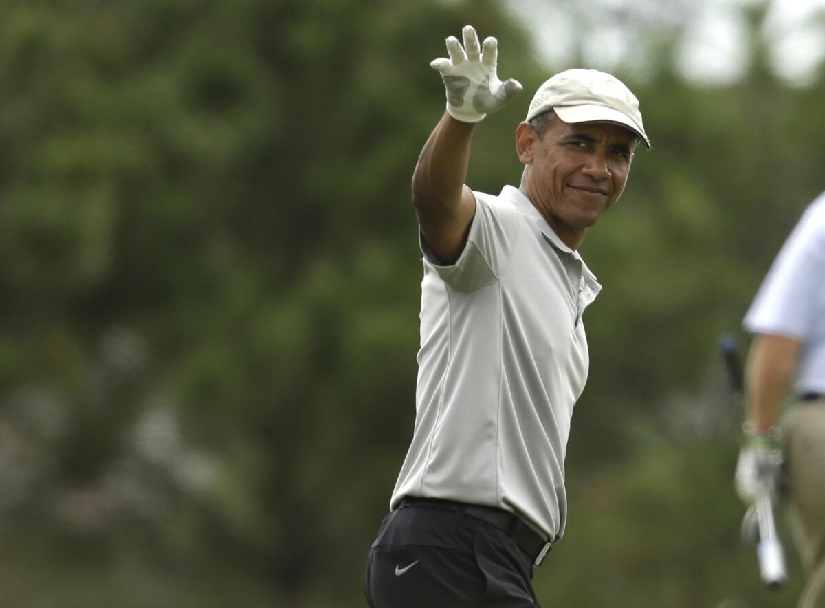 President Obama is pictured here after a last round of golf while on vacation on the island of Martha's Vineyard in Massachusetts.