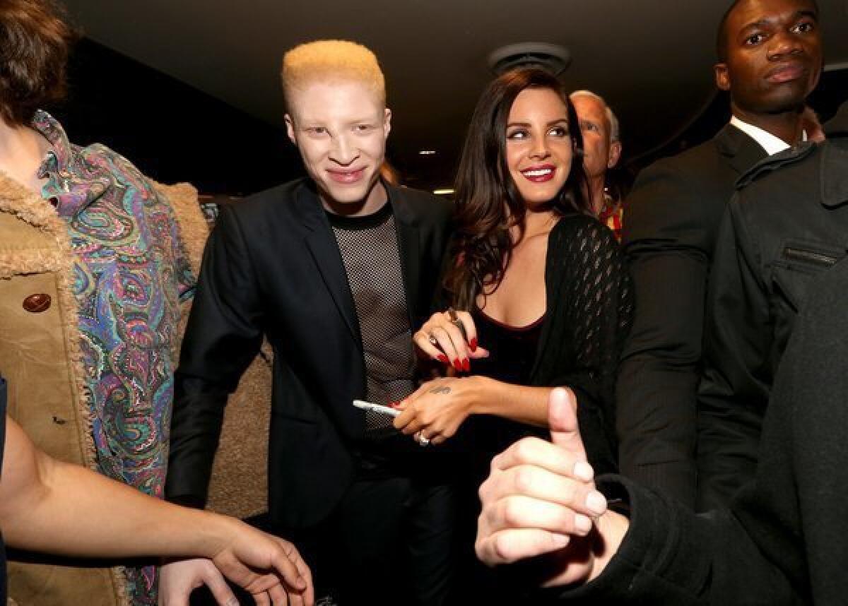 Lana Del Rey, right, and co-star Shaun Ross attend the premiere of "Tropico" in Hollywood.