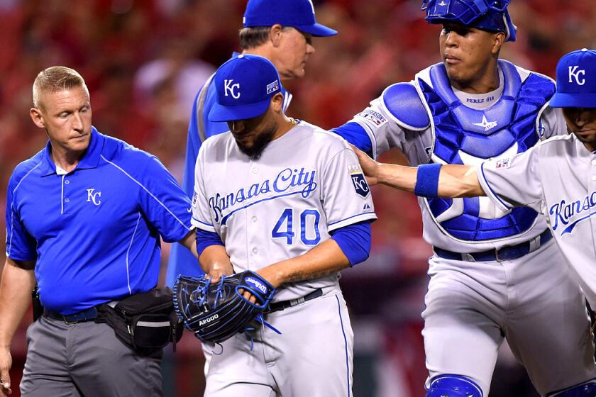 Royals relief pitcher Kelvin Herrera is helped off the field in the seventh inning Thursday night after injuring his forearm.