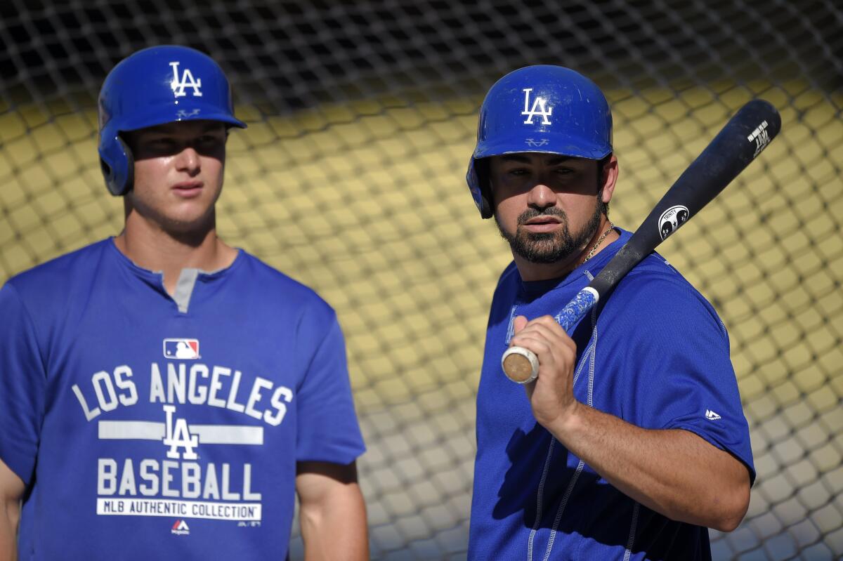 Joc Pederson and Adrian Gonzalez, right, wait to bat before a game against the Washington Nationals on Aug. 12.