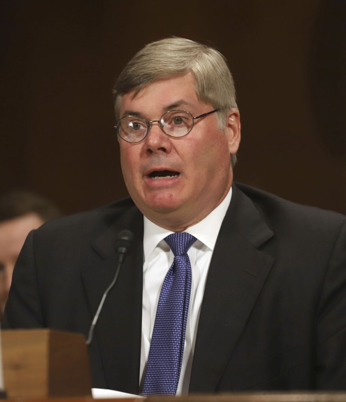 FILE -Robert R. Summerhays, President Donald Trump's nominee for District Judge for the Western District of Louisiana gives testimony during a U. S. Senate Judiciary Committee Hearing on Capitol Hill in Washington on Wednesday, April 11, 2018. Robert R. Summerhays, a federal judge hears arguments Friday, May 13, 2022 on whether the Biden administration can lift pandemic-related restrictions on immigrants requesting asylum later this month.(AP Photo/Harry Hamburg, File)