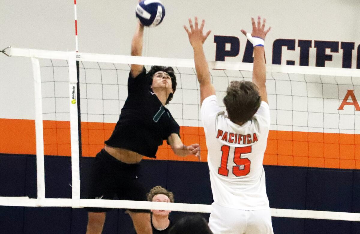 Sage Hill's Connor Gapp (1) spikes the ball against Pacifica Christian's Spence Richards (15) on Friday.