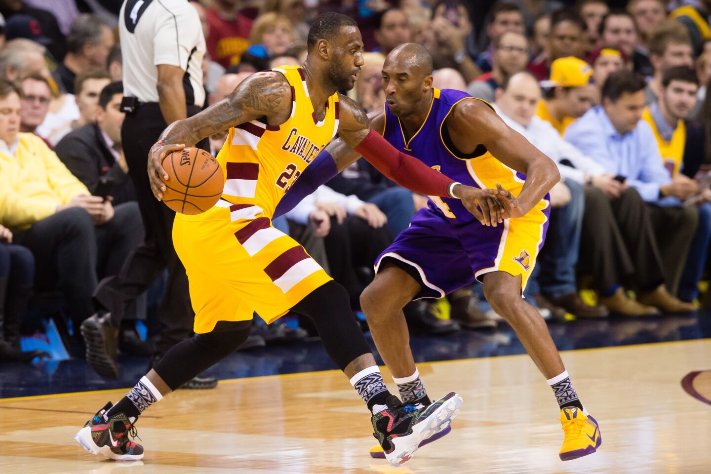 Cavaliers forward LeBron James is guarded by Kobe Bryant during the first half of a game on Feb. 10.