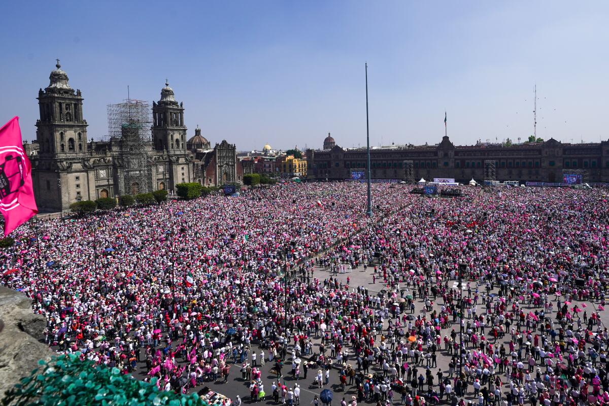 Thousands of protesters in pink demonstrate in Mexico City.