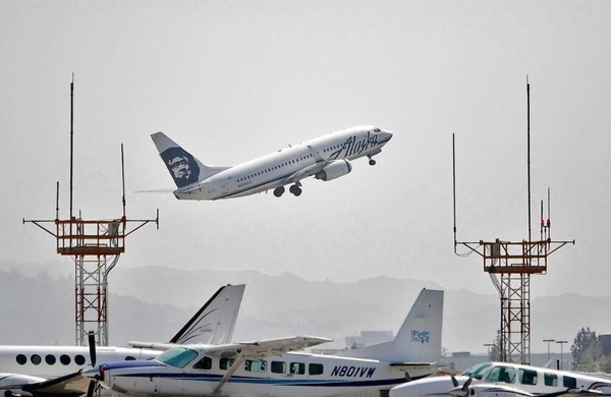 An Alaska Airlines flight takes off from the Burbank's Bob Hope Airport in March.