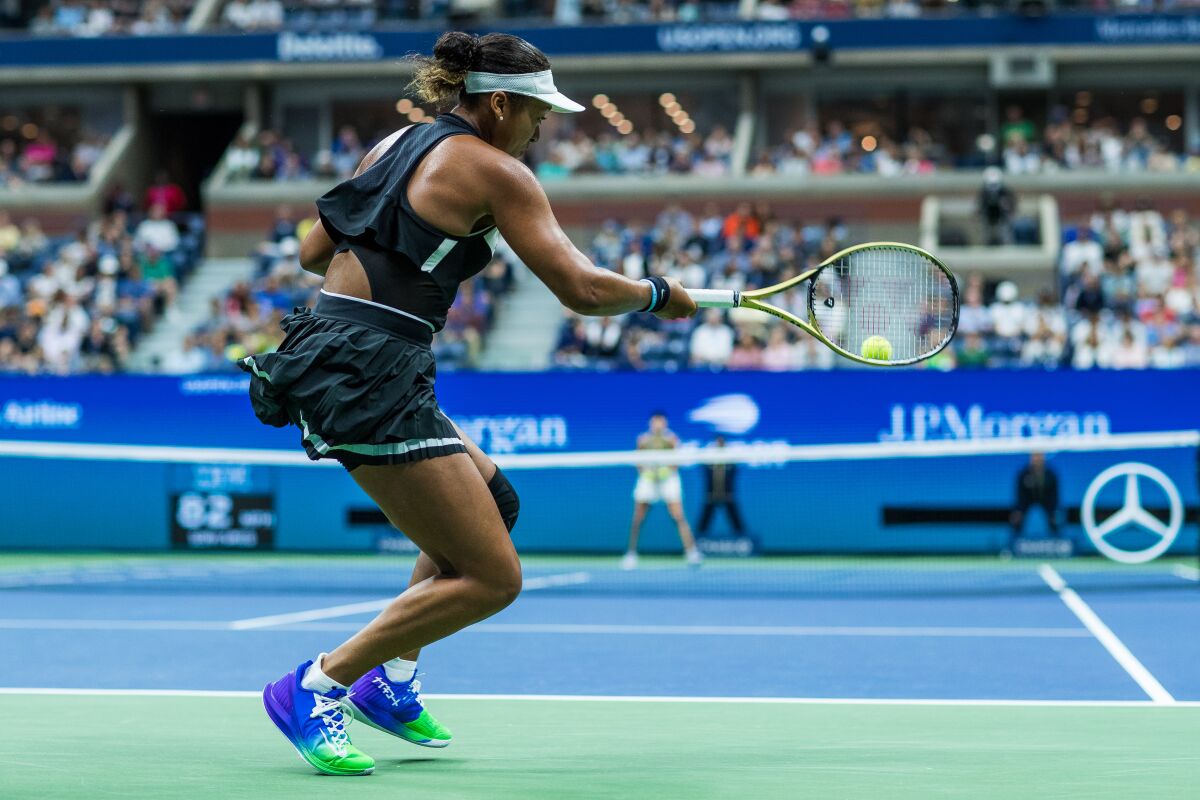 Naomi Osaka returns a shot during her loss to Belinda Bencic at the U.S. Open on Monday.