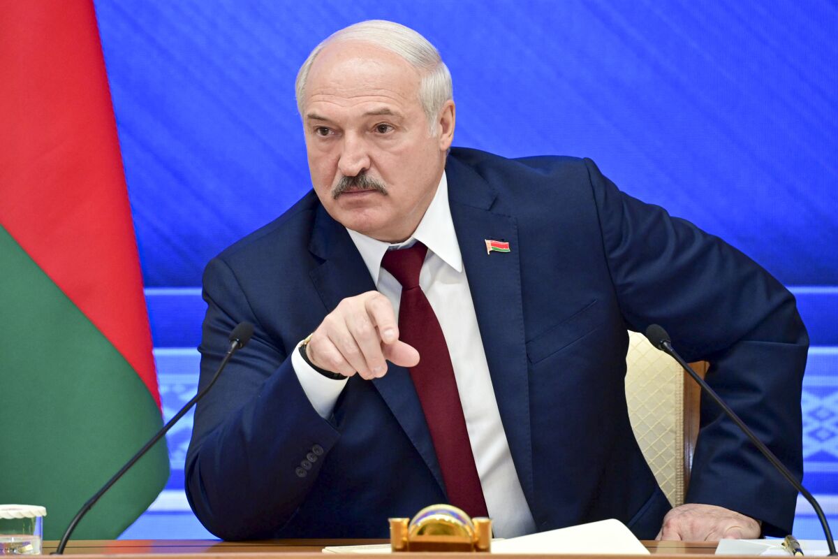 FILE - In this Monday, Aug. 9, 2021 file photo, Belarusian President Alexander Lukashenko gestures while speaking during an annual press conference in Minsk, Belarus. The authoritarian leader of Belarus said Wednesday Sept. 1, 2021, that the country will soon receive a large batch of Russian weapons, including dozens of combat jets, helicopters and top-of-the-line air defense missile systems. (Andrei Stasevich /BelTA photo via AP, File)