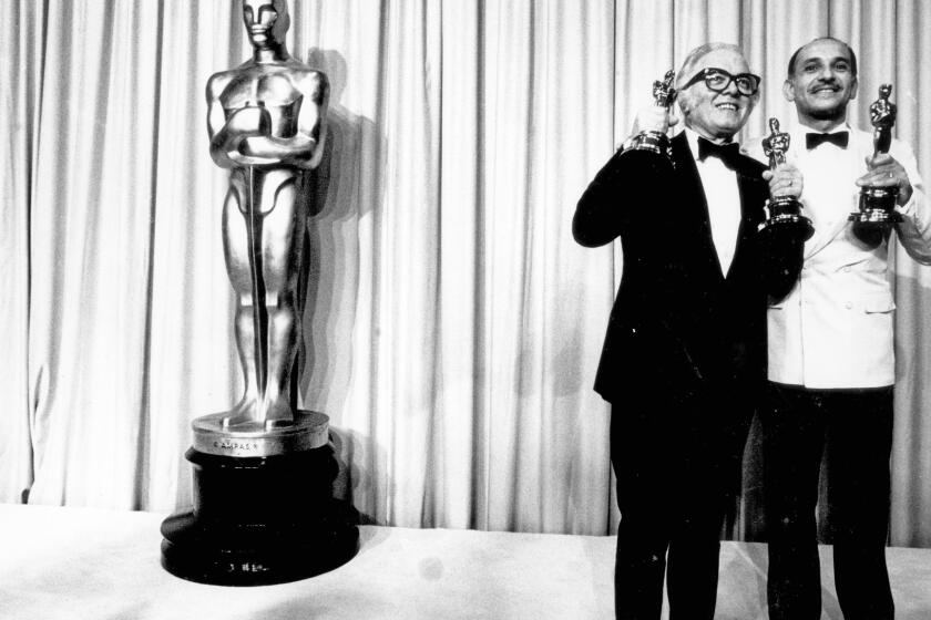 Richard Attenborough with Oscars for director and best film for "Gandhi" and Ben Kingsley with his lead actor Oscar at the Academy Awards on April 11, 1983.