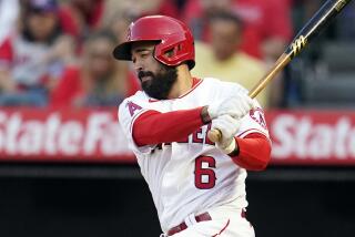 Los Angeles Angels' Anthony Rendon follows through on an RBI single during the first inning.