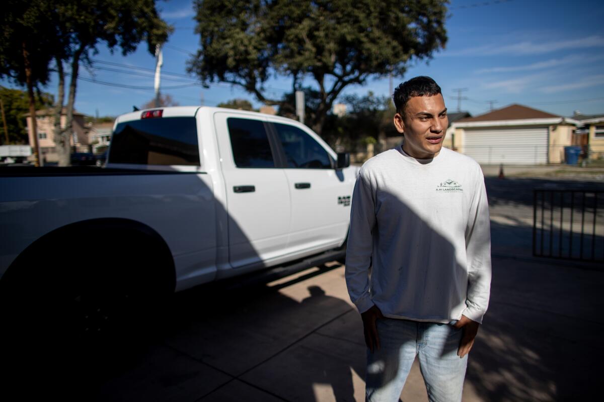 Andres Benitez stands by his brand new truck. Benitez chased a man out of his house with a kitchen knife.