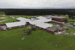 Debris from a tornado spun off by the remnants of Tropical Storm Debby, litters the campus of Springfield Middle School in Lucama, N.C., on Thursday, Aug. 8, 2024. (AP Photo/Allen G. Breed)