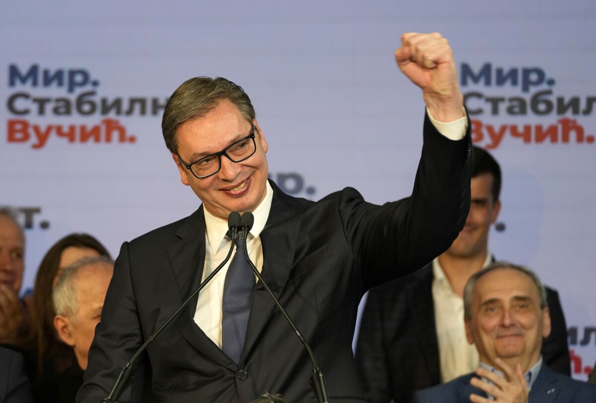 Serbian President and presidential candidate Aleksandar Vucic gestures during a news conference after claiming victory in the presidential election in Belgrade, Serbia, Sunday, April 3, 2022. Vucic and his populist right-wing party appeared headed to victory in Sunday's national election, extending a decade-long authoritarian rule in the Balkan country, according to early pollsters' projections. (AP Photo/Darko Vojinovic)