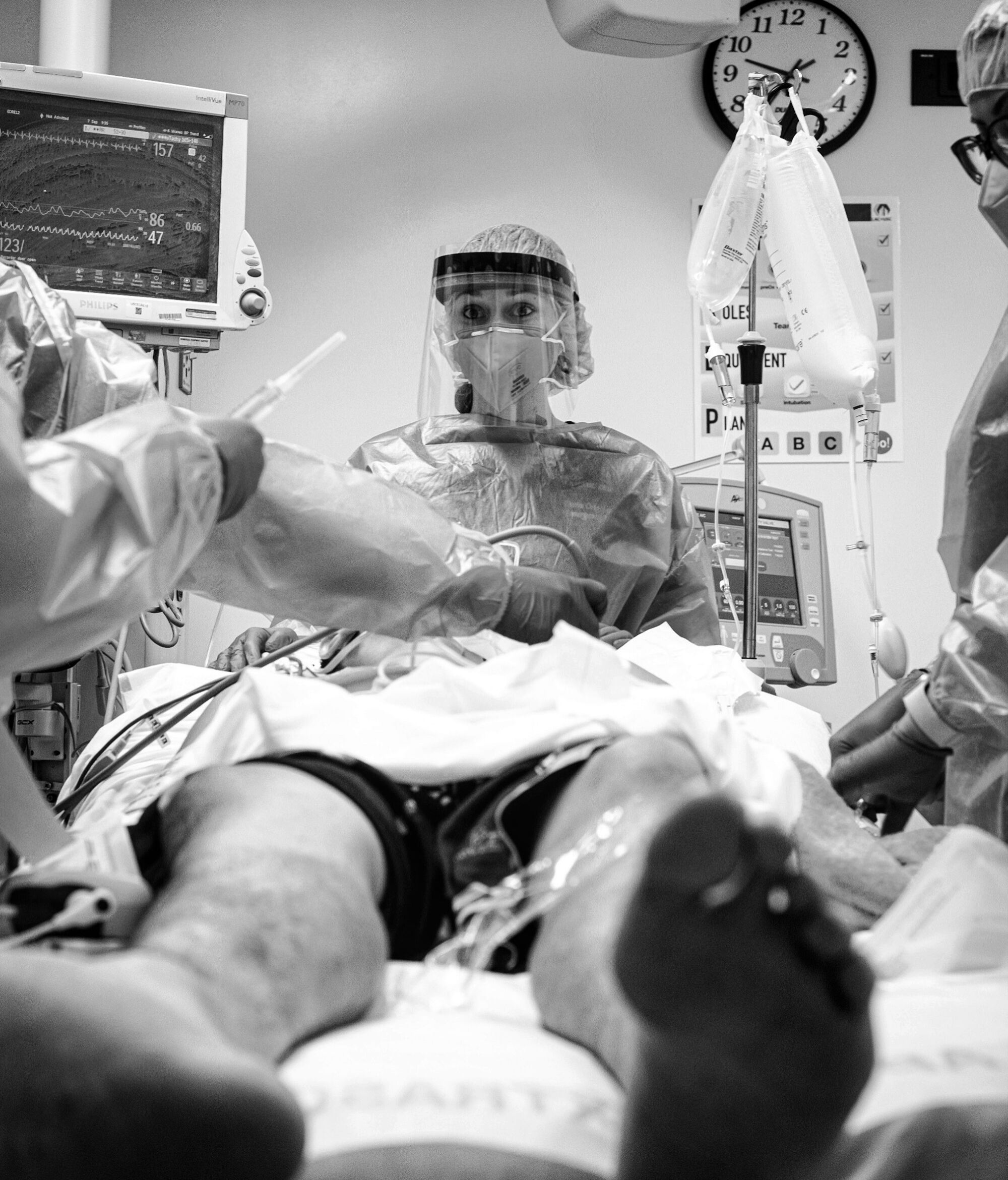 Dr. Daria Osipchuk looks out at her team before intubating a young man.