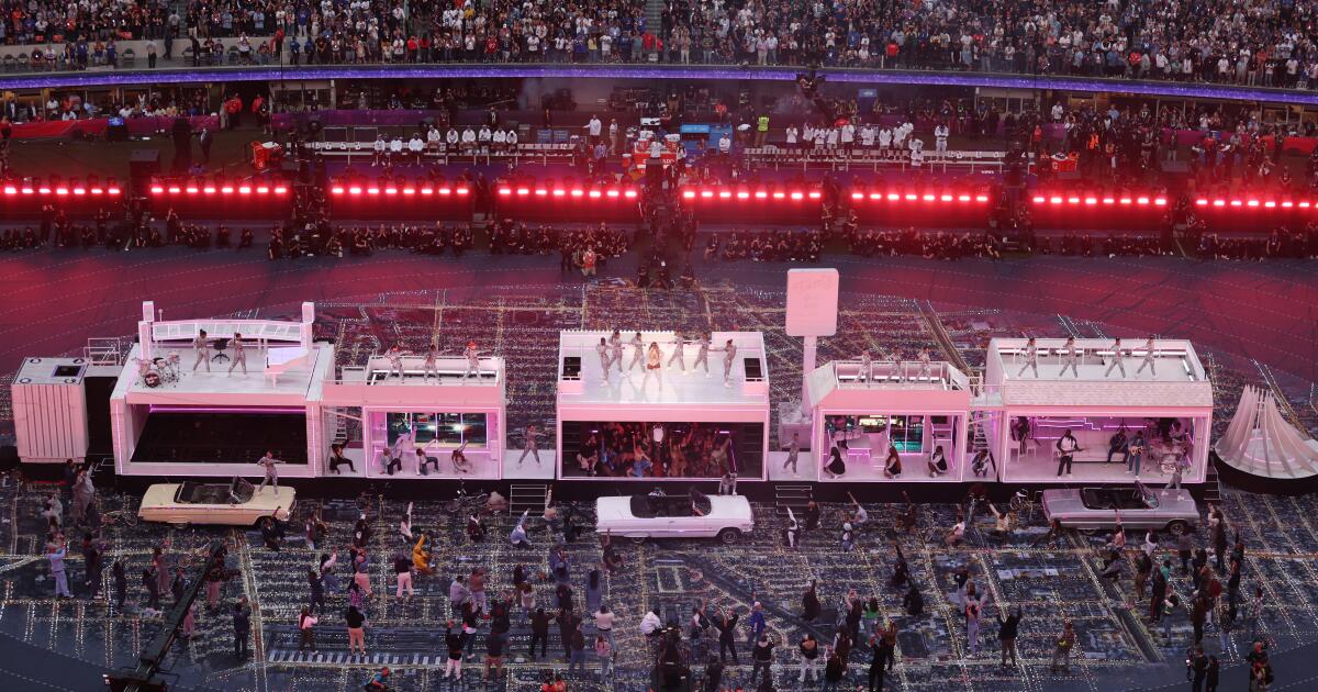 Fans shop at an official souvenir shop at Super Bowl Boulevard , a