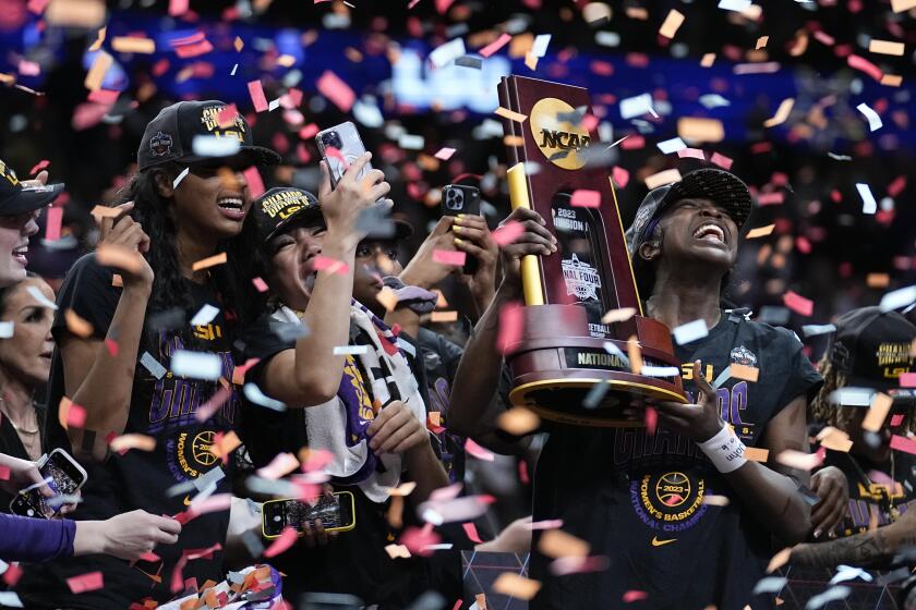 LSU players celebrate after the NCAA Women's Final Four championship basketball game against Iowa.