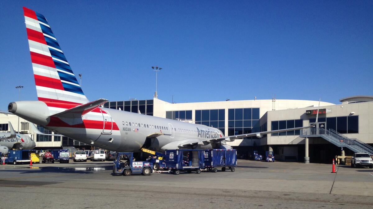 An American Airlines plane wait to takeoff from Los Angeles International Airport. The Fort Worth-based carrier wants to break its contract with Gogo, its onboard Wi-Fi provider.