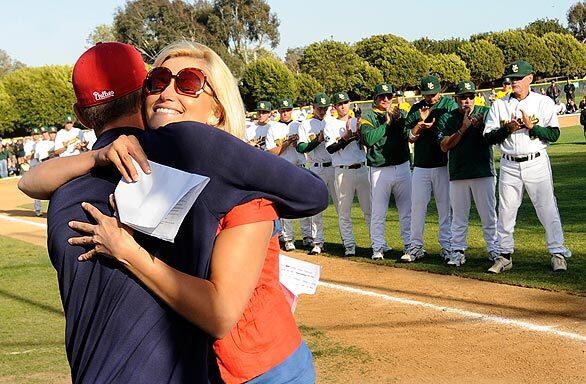 Holly Pickard gets a hug from Steve Hershey during a memorial service at Mira Costa High's baseball field in honor of her college boyfriend, Henry Pearson, who was killed in a car accident along with Angels pitcher Nick Adenhart and another passenger on April 9.