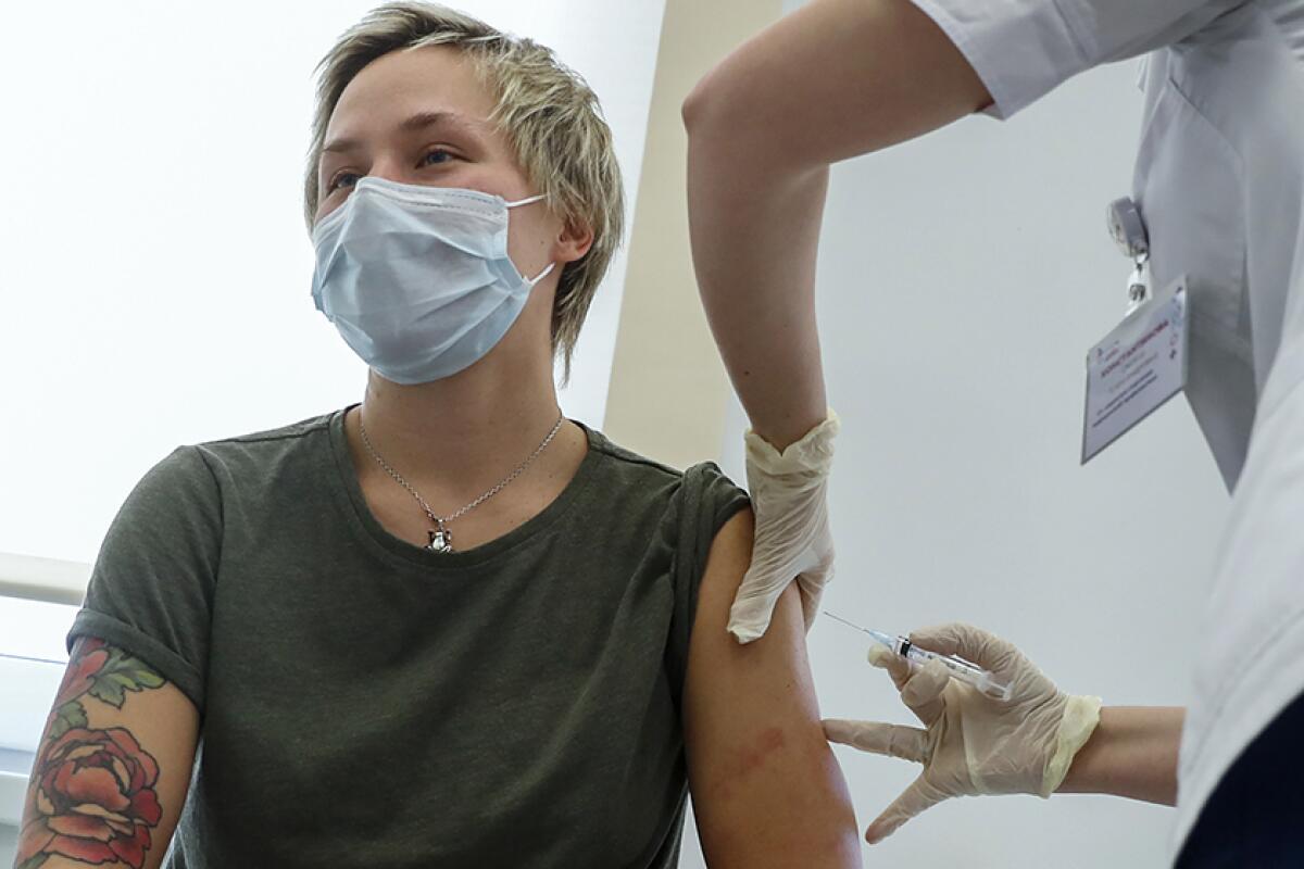 A woman receives the Sputnik V coronavirus vaccine in Moscow on Saturday.