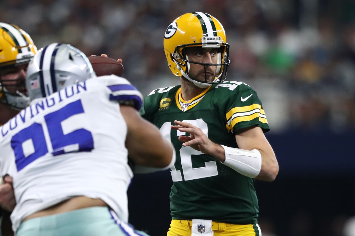 Green Bay Packers quarterback Aaron Rodgers looks to pass against the Dallas Cowboys.