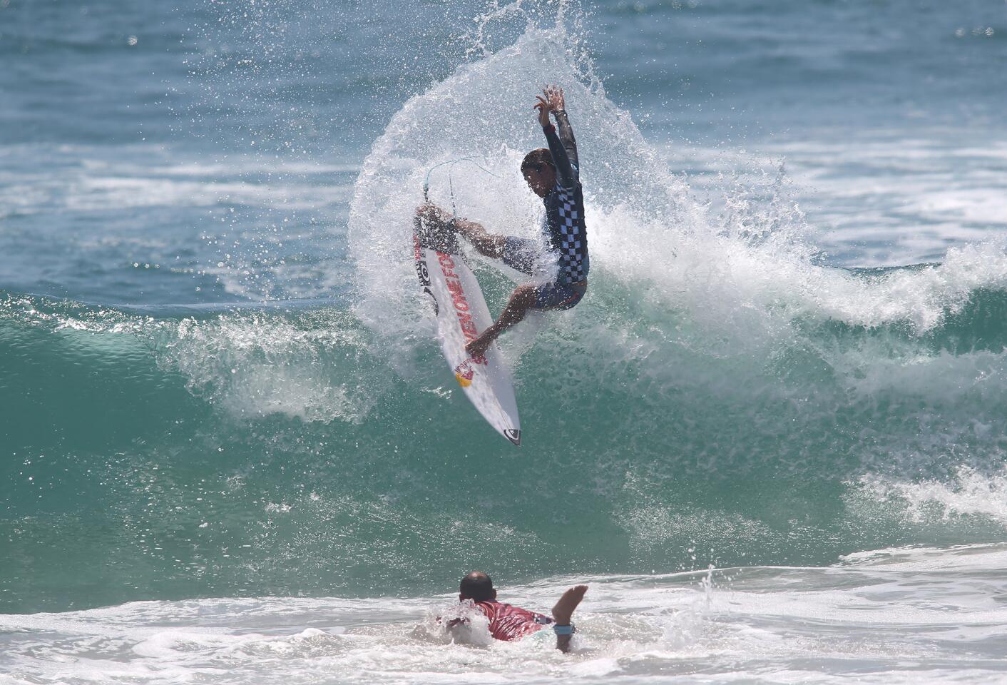 Huntington Beach's Kanoa Igarashi goes hard off the top as he surfs his way to the final against Jadson Andre during the Men's US Open semi-final on Sunday.