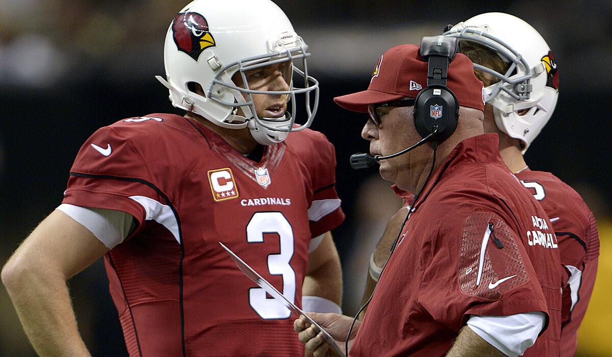 Arizona Cardinals head coach Bruce Arians, right, talks to quarterback Carson Palmer (3) in the first half of an NFL football game against the New Orleans Saintsin New Orleans, Sunday, Sept. 22, 2013. (AP Photo/Bill Feig) ** Usable by LA and DC Only **